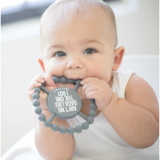 baby chewing on teether