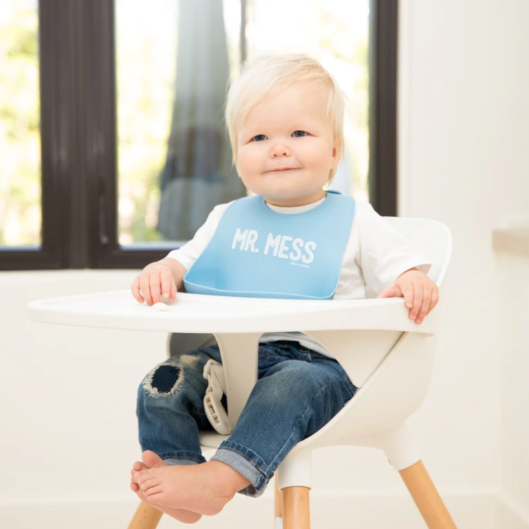 baby wearing blue bib