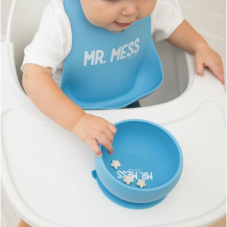 baby wearing blue bib