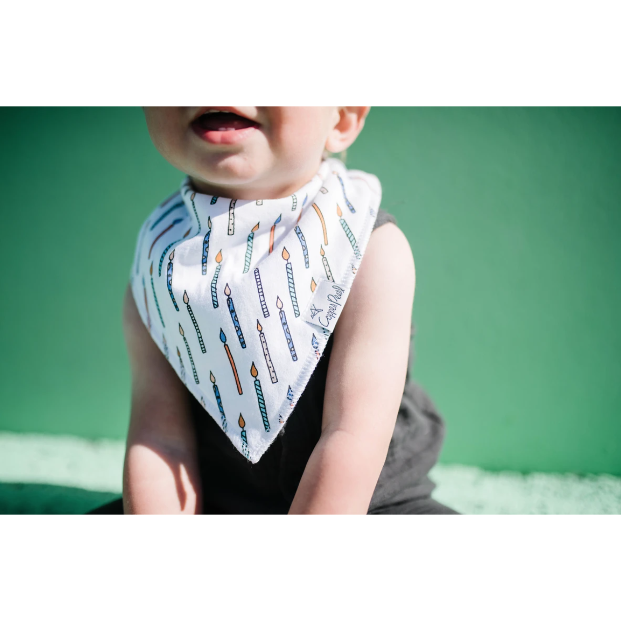 baby in confetti bib